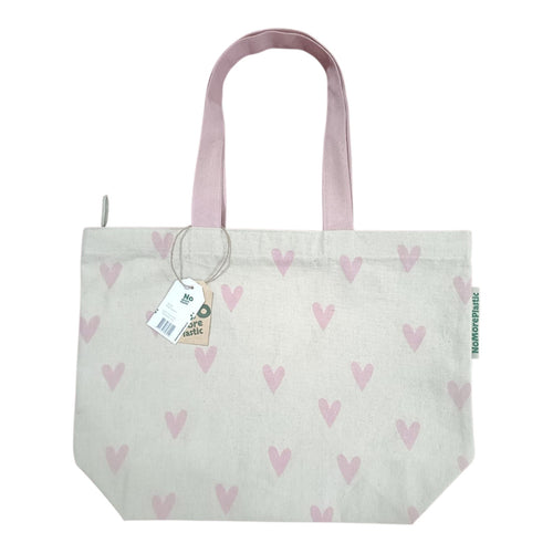 Duurzame tas van gerecyled katoen. De tas met lange roze hengsels heeft een print van kleine roze hartjes